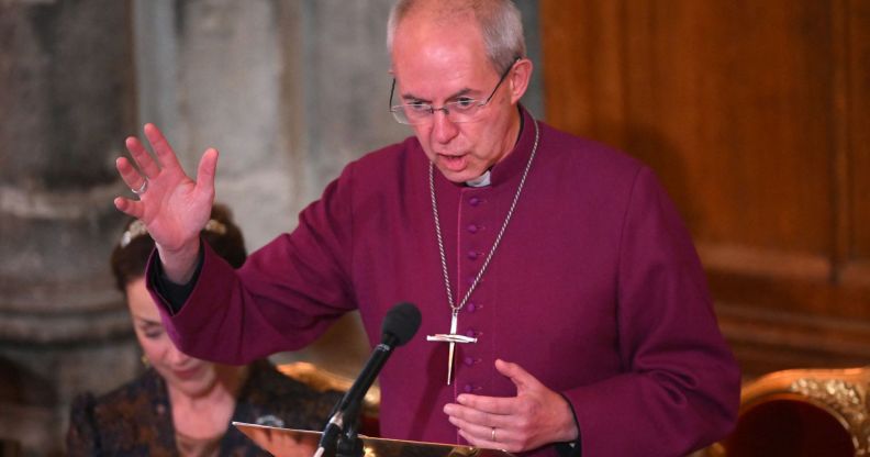 Justin Welby speaks in a purple robe during an event.