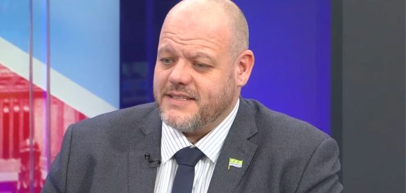 Mark Jenkinson, a Tory MP, speaking during an appearance on GB News. He is pictured wearing a grey suit and a navy tie with a white shirt.