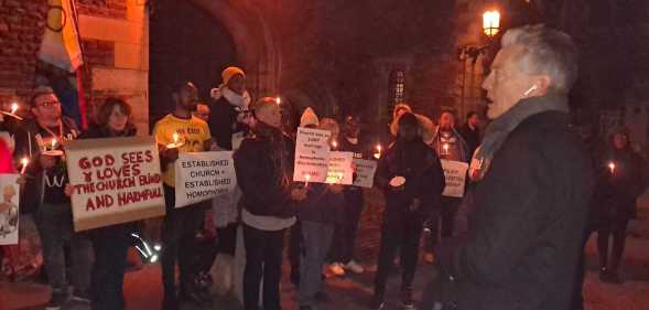 A photo shows LGBTQ+ protesters outside Lambeth Palace. To the right is Labour MP Ben Bradshaw