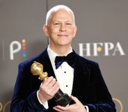 Ryan Murphy holding his Golden Globe Carol Burnett Award