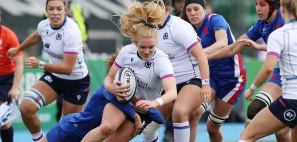 Megan Gaffney of Scotland is tackled by Marie-Aurelie Castel of France during the Scotland and France Women's Six Nations matc at Scotstoun Stadium on April 10, 2022 in Glasgow, Scotland.