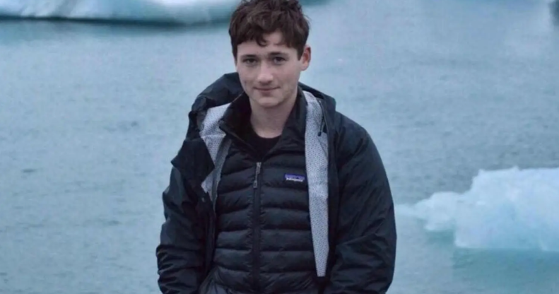 A photo of murdered gay Jewish student Blaze Bernstein pictured standing in front of frozen lake