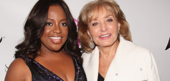 A photo of American actor and broadcaster Sherri Shepherd wearing a black evening dress and Barbara Walters wearing a white jacket over a black top