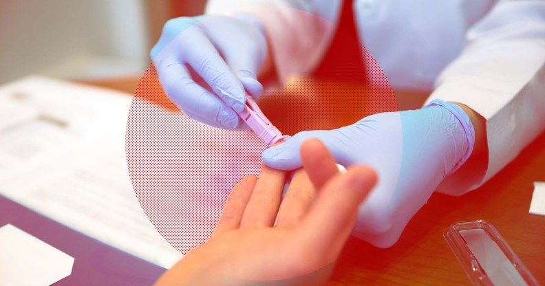 A medical professional's gloved hands as they take a blood sample from a person's finger to test for HIV.