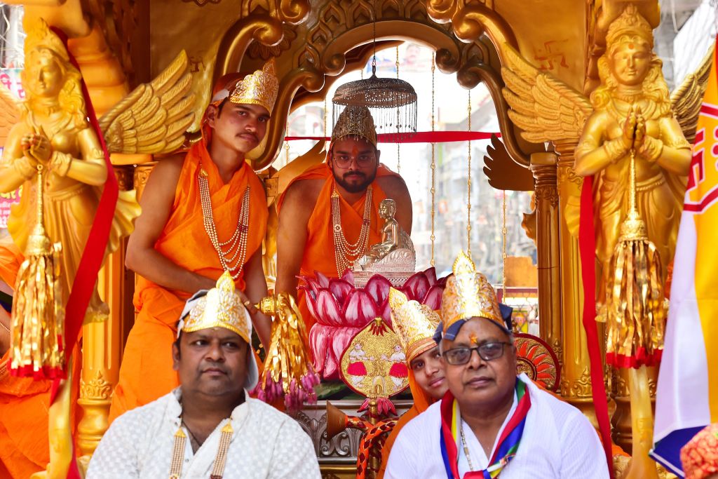 Priests of the Jain community offer prayers to Lord Mahavir during a religious procession on the occasion of 'Mahavir Jayanti' in Allahabad