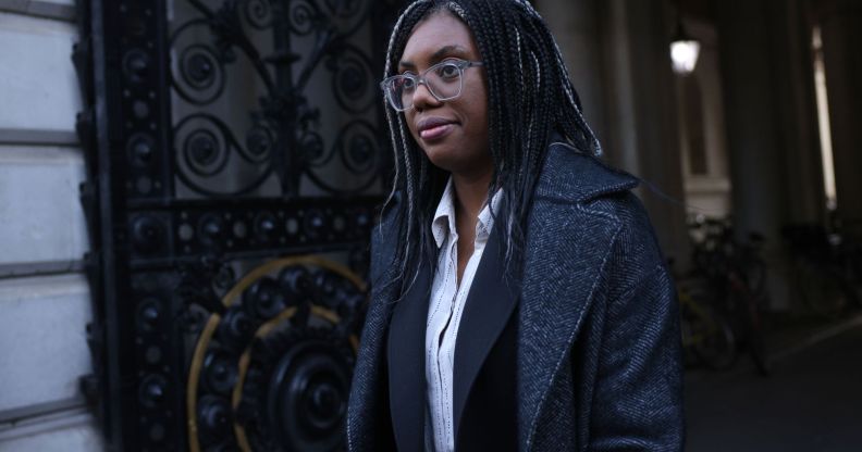 Kemi Badenoch walking through a street in London.