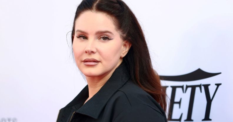 Lana Del Rey is wearing a black jacket and looking off to the side while on the red carpet at the 2021 Variety Hitmakers Brunch.