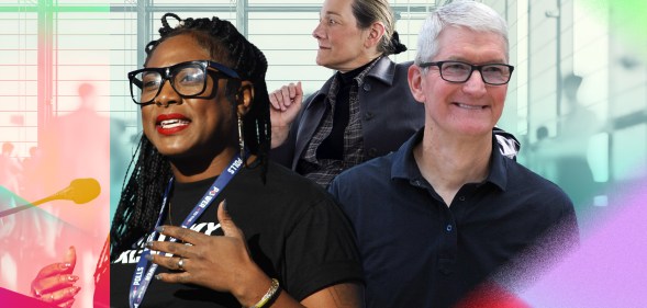 Alicia Garza is smilling while speaking. Tim Cook is wearing a black shirt and smiling, and Martine Rothblatt is in the background.