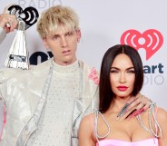 Machine Gun Kelly (L) with fiancé Megan Fox. (Getty)