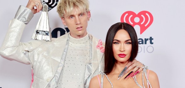 Machine Gun Kelly (L) with fiancé Megan Fox. (Getty)