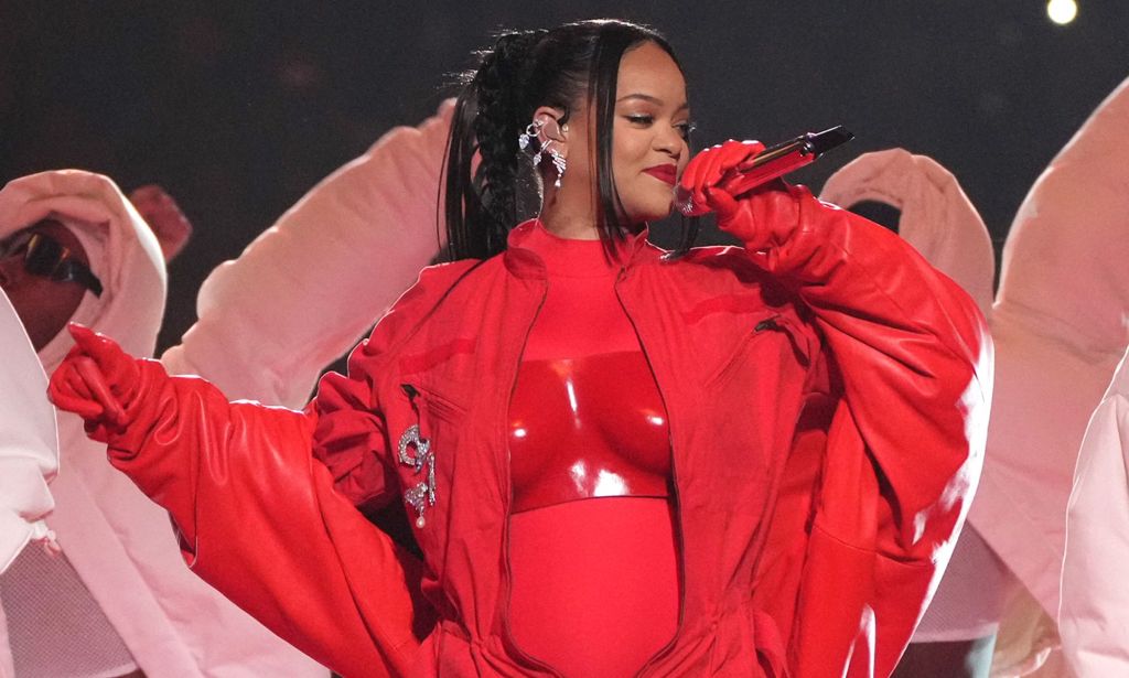 Rihanna in a full red outfit duruing the Super Bowl halftime show.