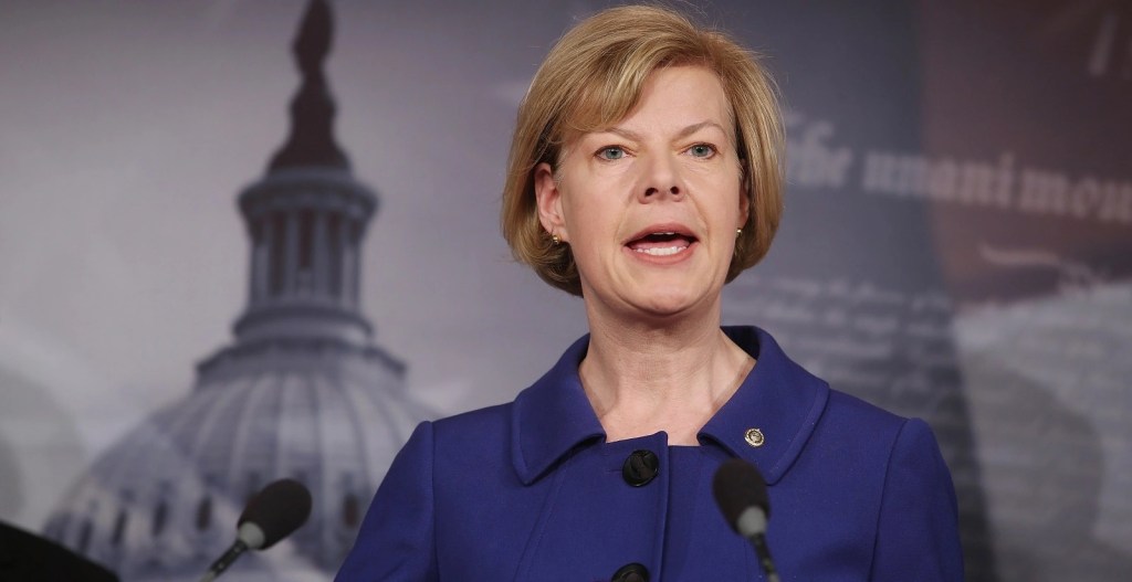 Tammy Baldwin wears a blue jacket