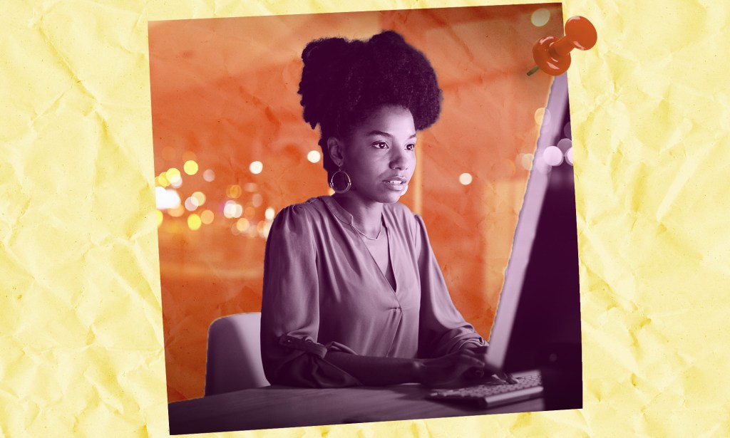 Woman working at a computer on a project.
