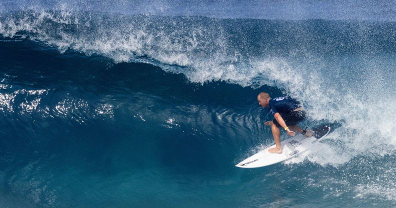 A surfer riding a wave