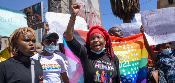 Demonstrators hold placards and chant slogans during the protest in Nairobi.