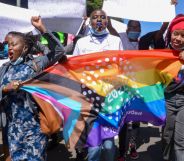 Demonstrators are seen marching with an LGBTQ flag during a protest in Nairobi.