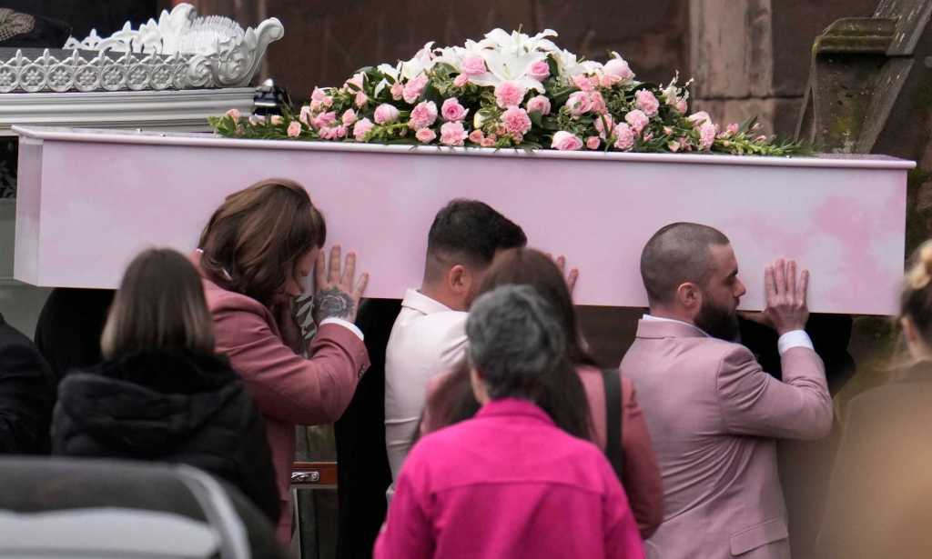 WARRINGTON, ENGLAND - MARCH 15: The coffin Brianna Ghey is carried into St Elphin's Church on March 15, 2023 in Warrington, United Kingdom. Brianna Ghey, a transgender girl, was stabbed in Culcheth Linear park, Cheshire on the evening of 11th February 2023. Two teenagers charged with the 16-year-old's murder have appeared in court and been remanded to Youth Detention. Brianna's family has paid tribute to their daughter saying "She was a larger-than-life character who would leave a lasting impression on all that met her. Brianna was beautiful, witty and hilarious. Brianna was strong, fearless and one of a kind". They have requested mourners wear pink to the funeral. (Photo by Christopher Furlong/Getty Images)