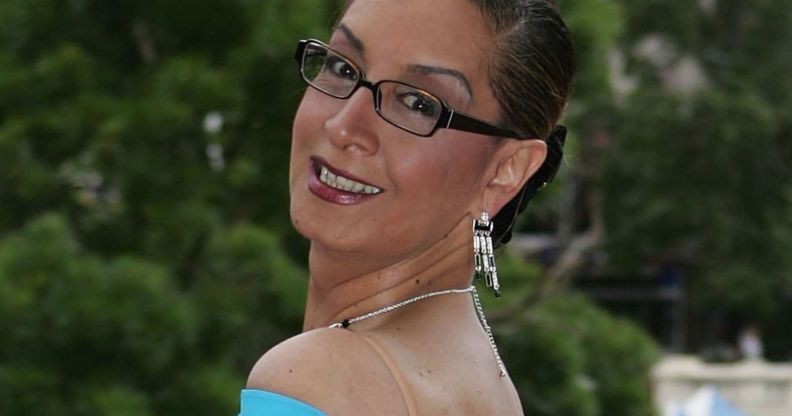 Georgina Beyers, at a red carpet event, smiles.