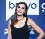 Real Housewives of Orange County star Heather Dubrow wears a black dress as she poses for the camera