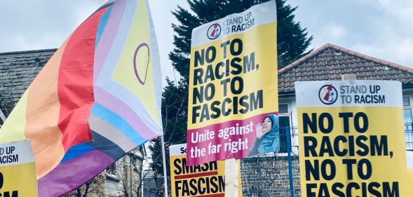 Anti-fascism and LGBTQ+ signs raised at the Honor Oak Pub.