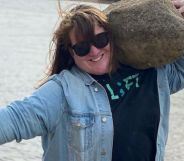 JayCee Cooper lifting a rock