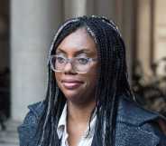 Kemi Badenich in dark jacket and white top