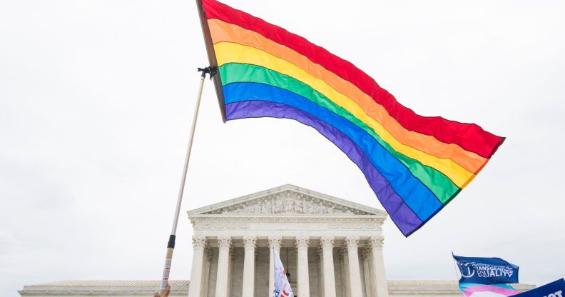 A Pride flag waves over the US House.