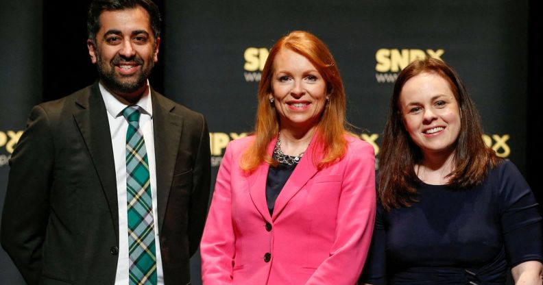 Humza Yousaf, Kate Forbs, and Ash Regan smile for a photo.