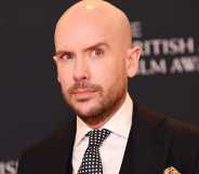 Tom Allen pictured on the red carpet at an event.