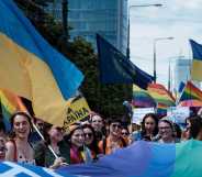 a pride parade in Poland feature the Ukrainian flag