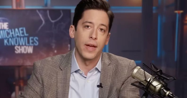 Daily Wire host Michael Knowles wears a button up shirt and jacket as he talks to his podcast/show audience about his anti-trans Conservative Political Action Conference (CPAC) speech