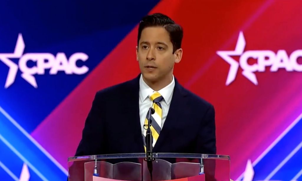 Daily Wire host Michael Knowles, who has a show and podcast, stands at a podium as he attacks the trans community during a speech at the Conservative Political Action Conference (CPAC).