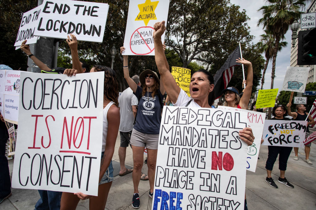 Hundreds of anti-vaccination protesters gathered in Los Angeles, California, City Hall August 14, 2021. 