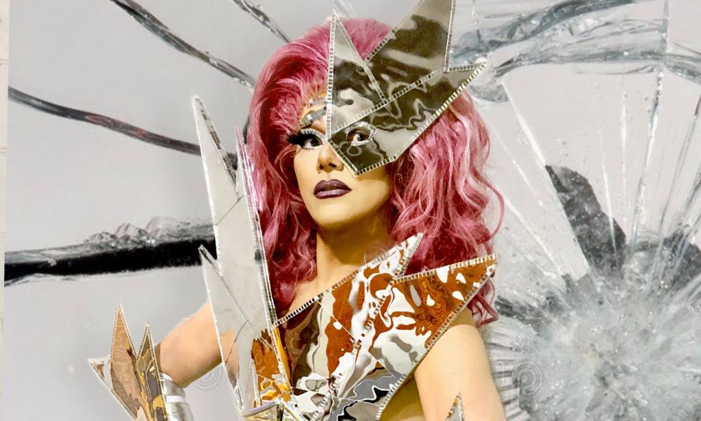 Tennessee drag queen Bella DuBalle, who has been fighting anti-LGBTQ+ bills and the state's drag ban, wears a silver outfit stylised to look like shards of a mirror or glass