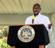 Uganda's president Yoweri Museveni standing at a lecturn