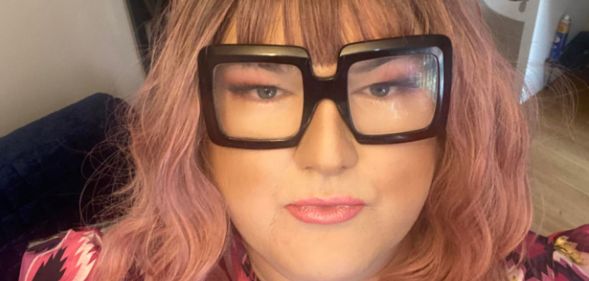 A woman with glasses and bangs.