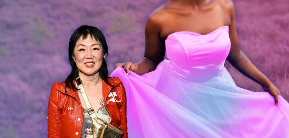 Margaret Cho in a red jacket and multi-coloured top stands against a background of a woman wearing a trans flag-coloured dress.