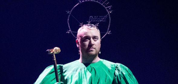 Sam Smith wears a headpiece with Brianna Ghey written on it at the Gloria Tour.