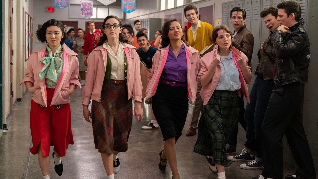 The Pink Ladies strutting through school.