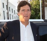 Tucker Carlson leaving a car.