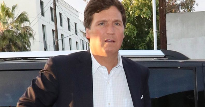 Tucker Carlson leaving a car.