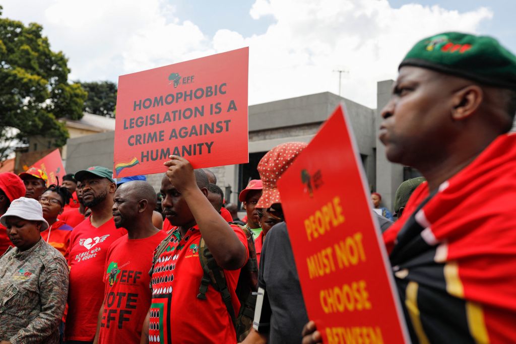 Economic Freedom Fighters supporters demonstrate outside the Uganda High Commission during a picket their against the country's anti-homosexuality bill. 