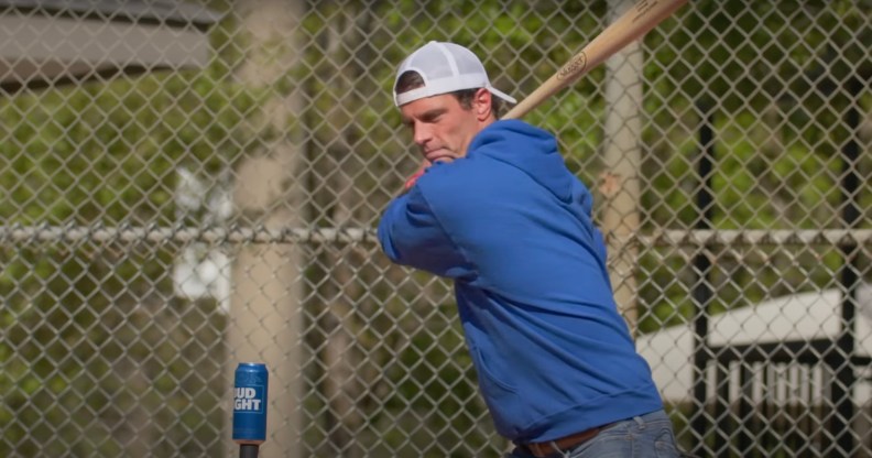 Seth Weathers hits a can of Bud Light with a baseball bat as part of an advert for Ultra Right Beer