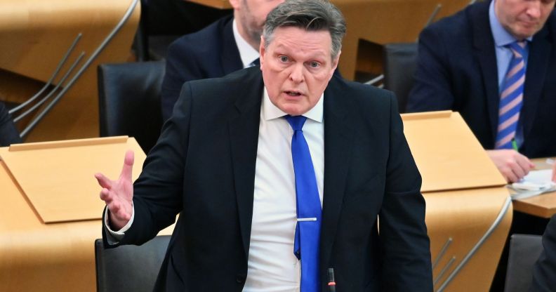 Scottish Tory MSP Stephen Kerr wears a suit and tie as he speaks before politicians gathered in Holyrood. He has been an opponent of Scotland's pro-trans Gender Recognition Reform bill