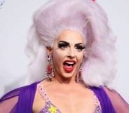 Drag Race star Alyssa Edwards in a pink and yellow top and violet blonde wig.