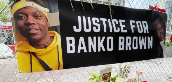 A banner above tributes to Banko Brown that reads "Justice for Banko Brown."