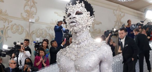 Lil Nas X in silver body paint at the Met Gala.