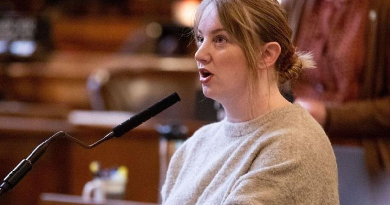 A picture of Megan Hunt speaking at her podium in the Nebraska state capitol.