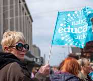 Woman holding NEU flag