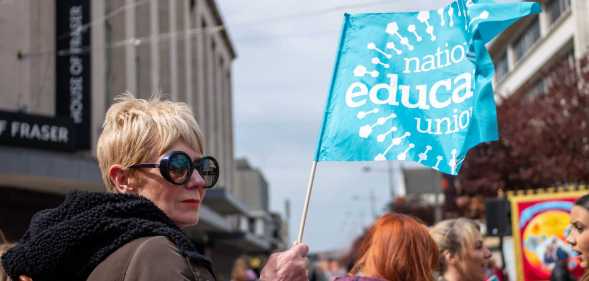 Woman holding NEU flag